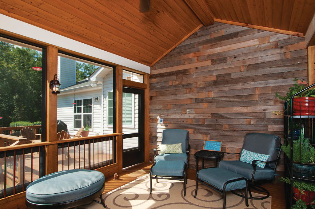 screened porch with wood wall