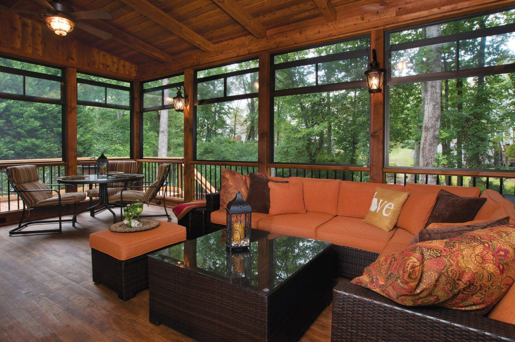 wooden deck with Eze-breeze porch and furniture