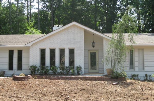 BEFORE installation of gabled roof portico with with wooden columns on white brick rancher 3