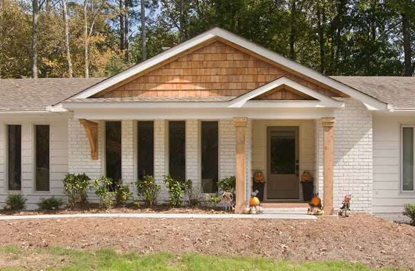 AFTER installation of gabled roof portico with with wooden columns on white brick rancher 3