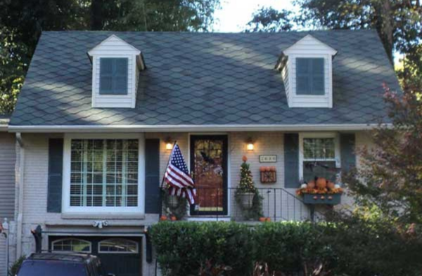 BEFORE installation of bracket portico with grey home blue/grey shutters