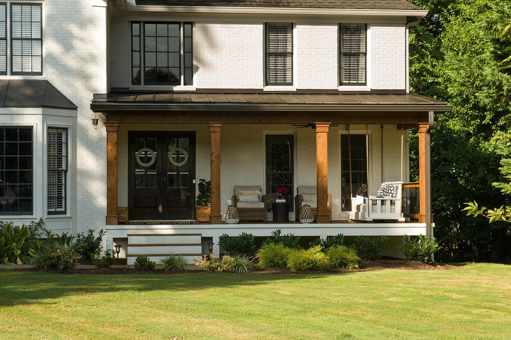 Dupree Case Study AFTER installation of front porch on large white home 3