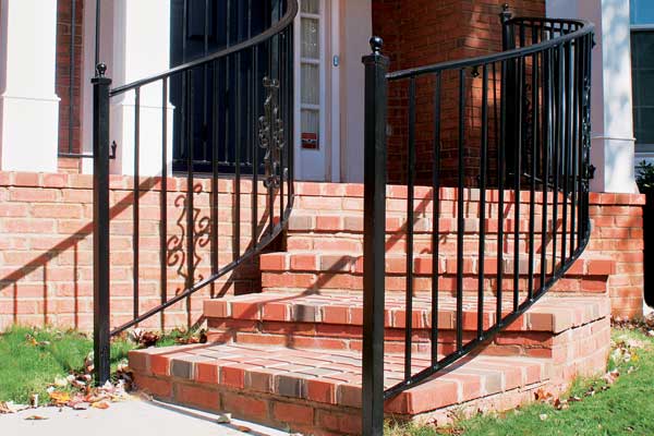 brick steps and metal railing on front porch