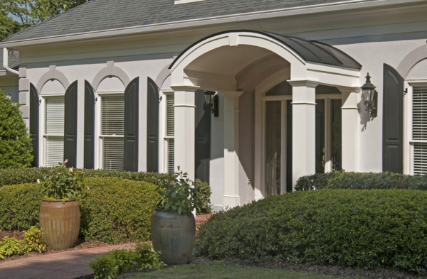 AFTER installation of arched roof portico on white house with black shutters 2