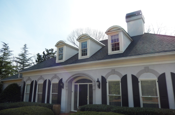 BEFORE installation of arched roof portico on white house with black shutters 2