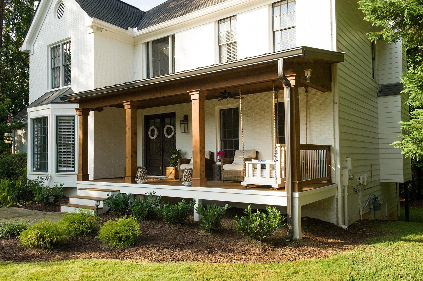 Dupree Case Study AFTER installation of front porch on large white home side view 2