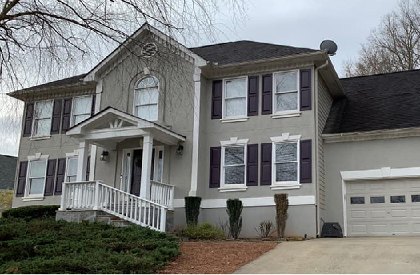 AFTER gabled roof portico installation on grey home with black shutters and white trim