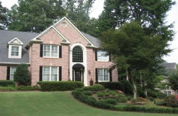 BEFORE installation of a gable roof portico on large brick house