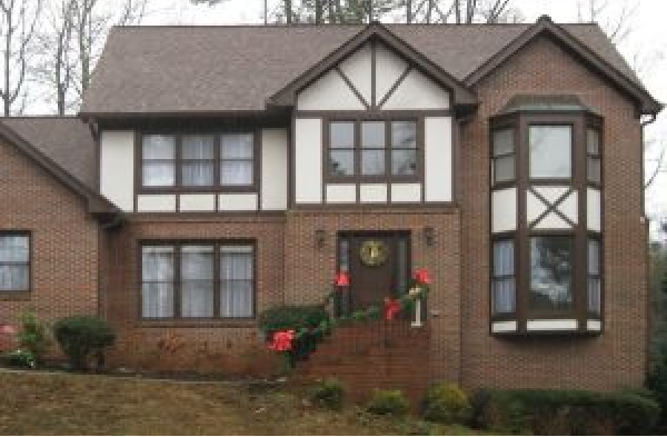 BEFORE installation of gabled roof portico on tudor brick home