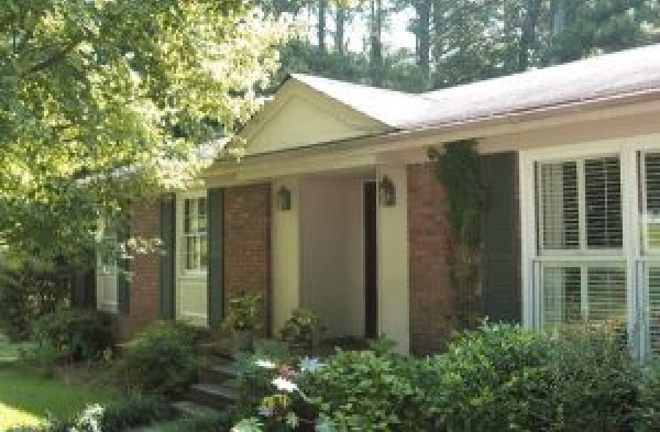 BEFORE installation of gabled roof portico on brick rancher home