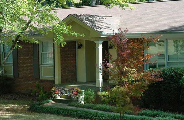 AFTER installation of gabled roof portico on brick rancher home