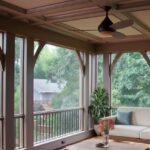 Screened porch and deck white couch with light blue cushions