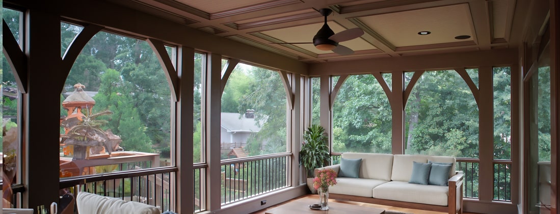 Screened porch and deck white couch with light blue cushions