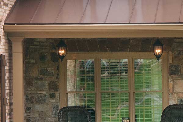 Steel roof with porch lights of front porch