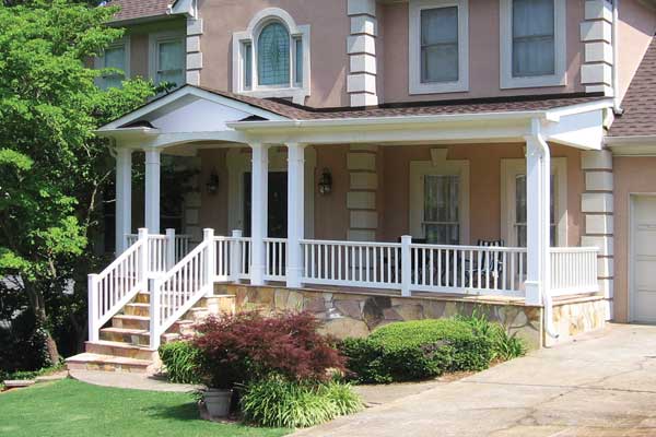 AFTER installation of traditional half front porch with square white columns and white balcony and stairs railing