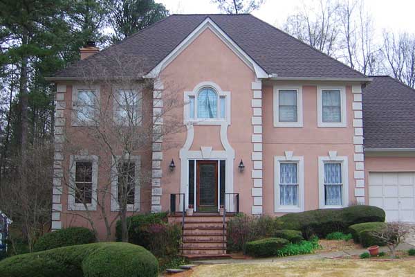 BEFORE installation of traditional half front porch with square white columns and white balcony and stairs railing