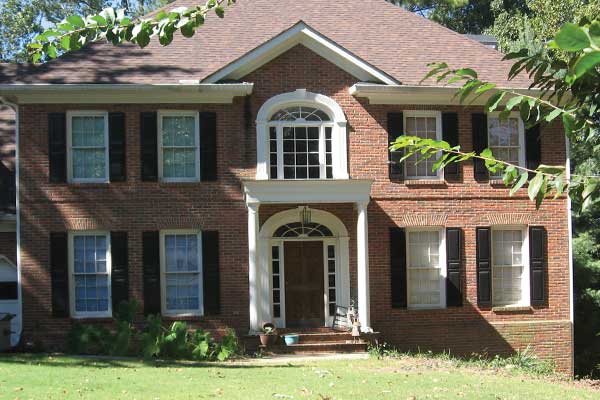 BEFORE installation of traditional front porch on square brick home