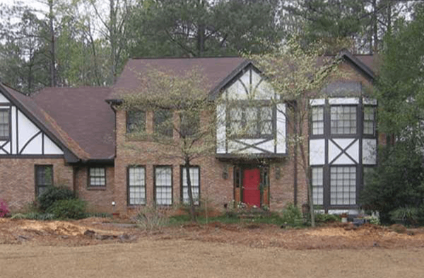 BEFORE installation of gabled roof portico on tudor brick home 2