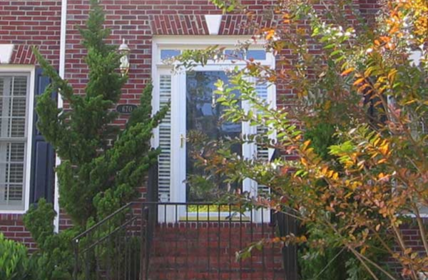 BEFORE installation of bracket portico with glass door on brick home