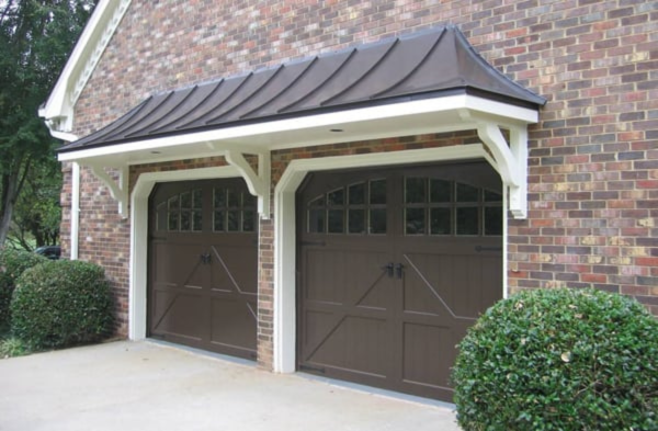 garage arbor and portico AFTER brick house two car brown garage doors 2