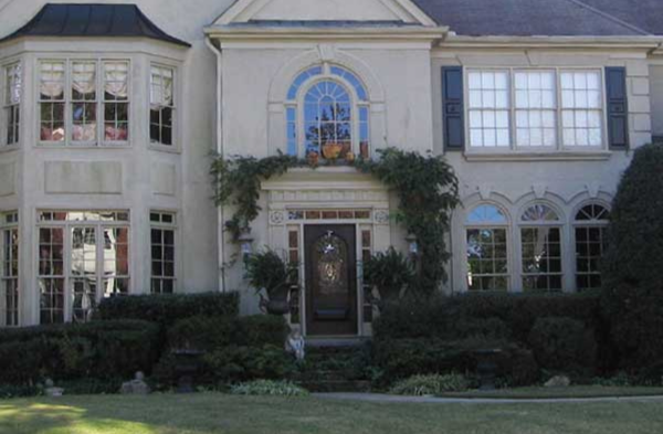 beige home brown door BEFORE portico installation