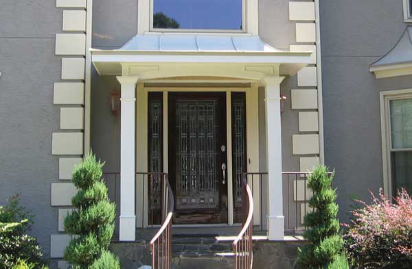 AFTER installation of hip roof portico on grey house with beige and white trim