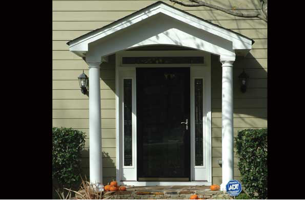 BEFORE installation of gabled roof portico on black door with white columns