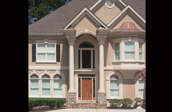 AFTER installation of gabled roof portico with tall white columns