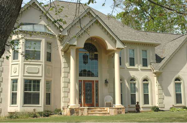 AFTER installation of gabled roof portico on large home