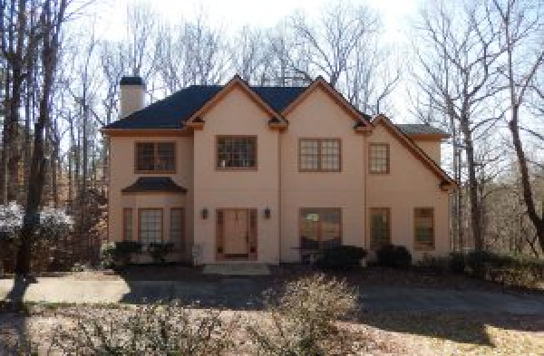 BEFORE gable roof portico on large beige home