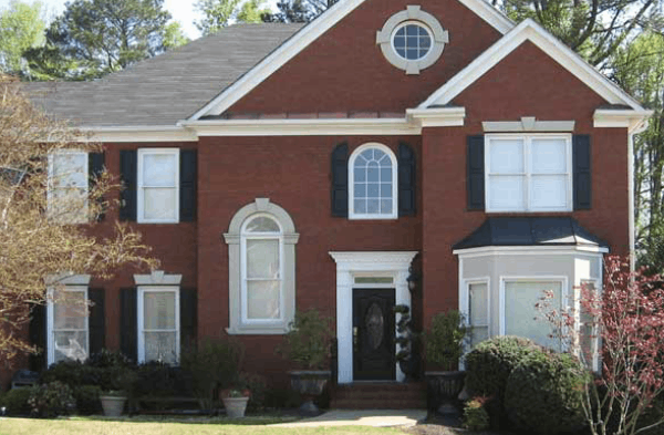 BEFORE front porch installation on a brick craftsman tudor home