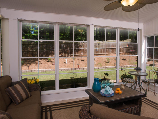 screened porch with ceiling to floor long windows inside view