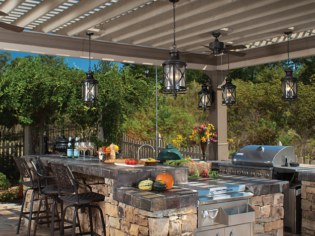 pergola over stone outdoor kitchen daytime