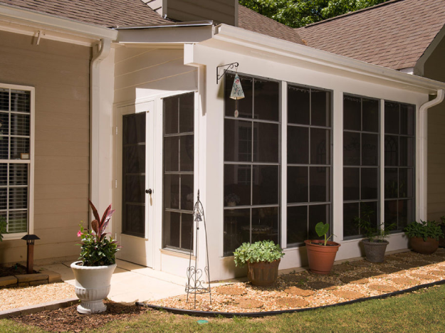 screened porch with ceiling to floor long windows