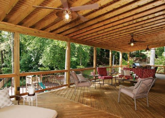 family-friendly expansive open porch with furniture facing woods