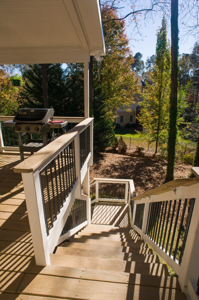 backyard steps going down from deck facing backyard