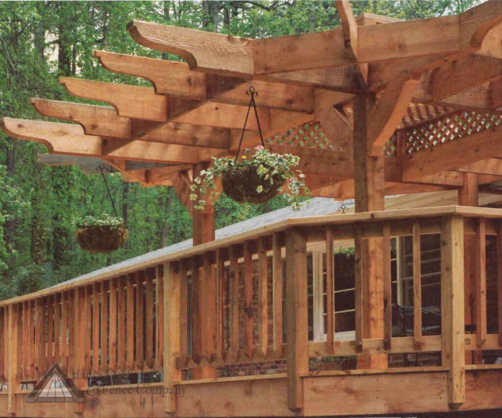 wooden pergola on wooden deck with hanging potted plants