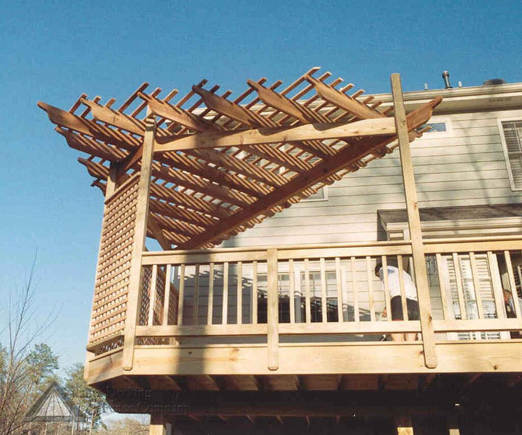 Triangular corner wooden pergola on wooden deck