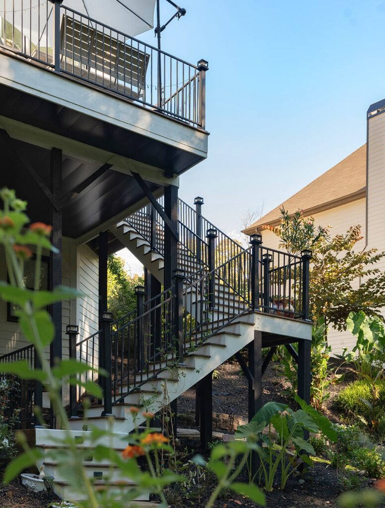 left vertical view of view of exterior stairs and deck from ground