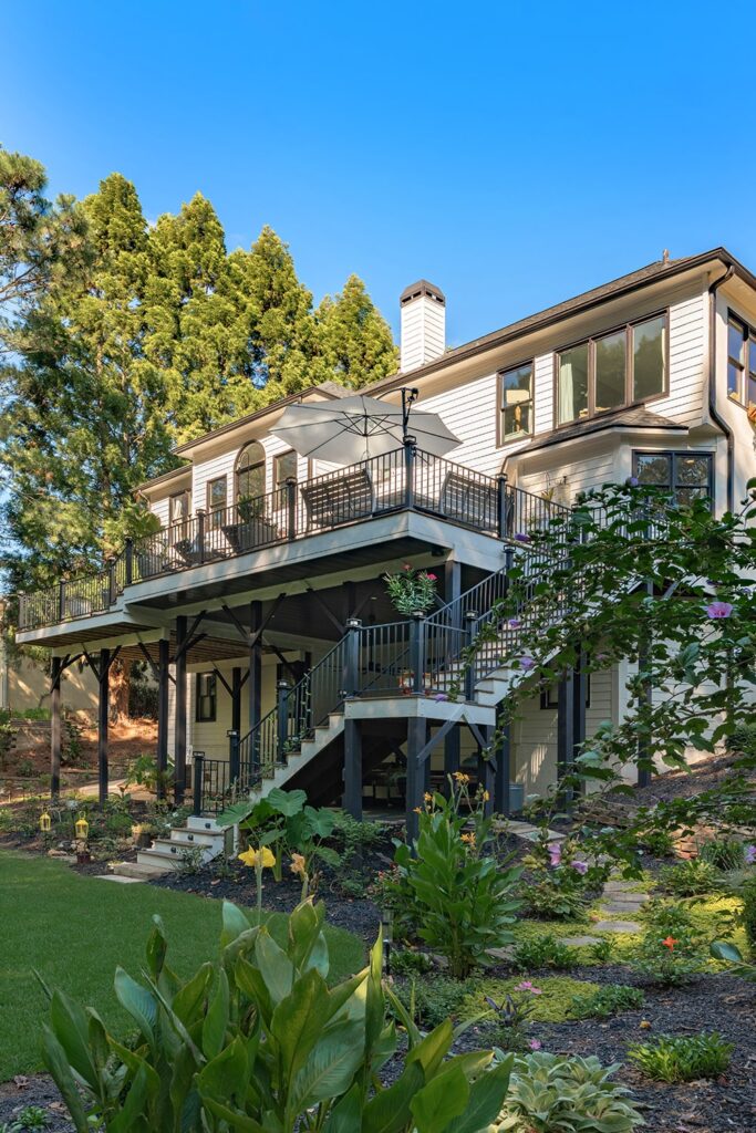 view of exterior stairs and deck from ground