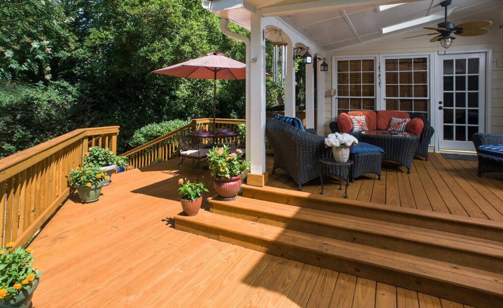 pressure treated deck and porch with extra wide stairs