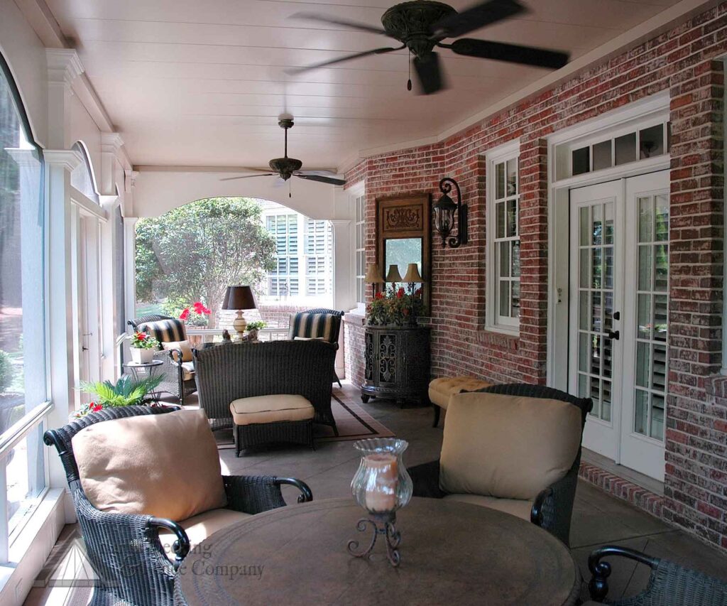 screened porch under deck brick home