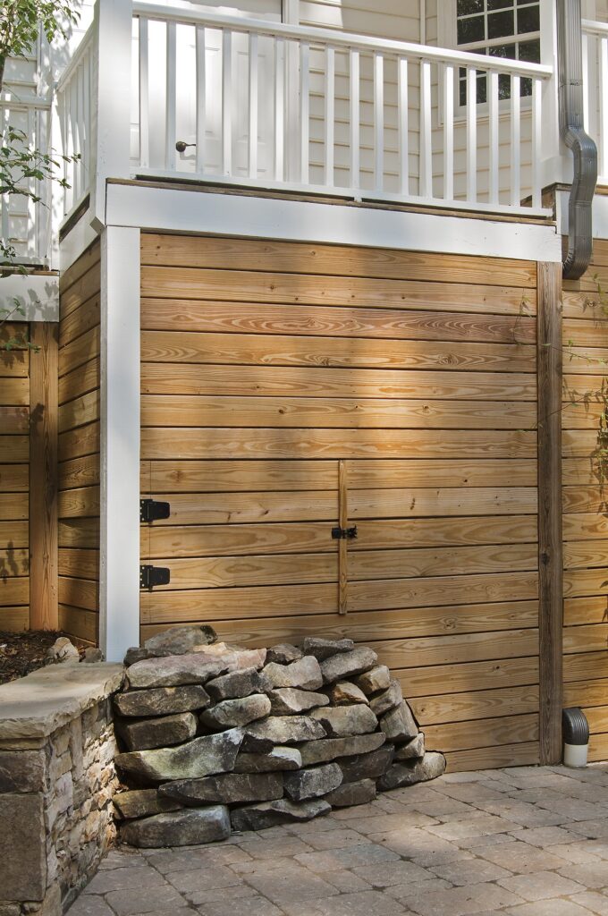 hidden under deck storage area wood