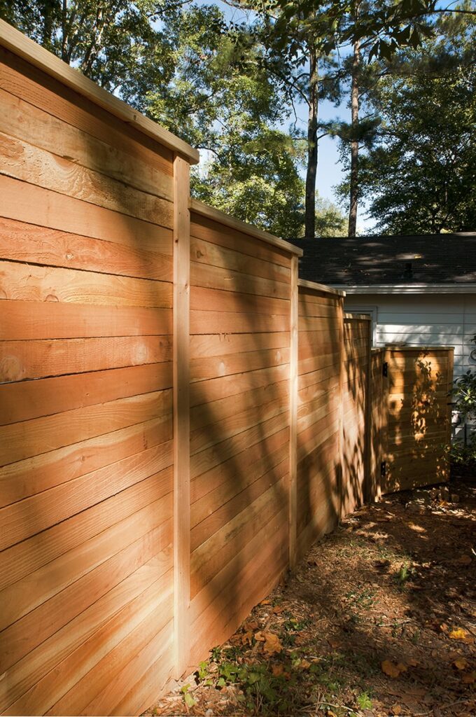 privacy fence down hill to gate