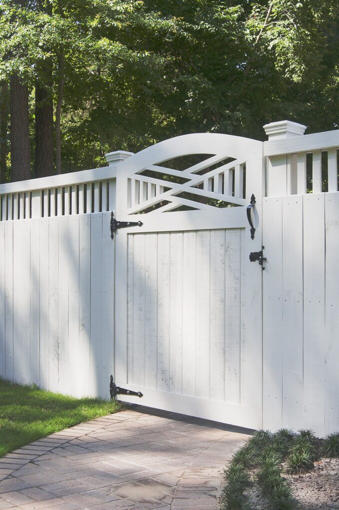 white wooden fence gate