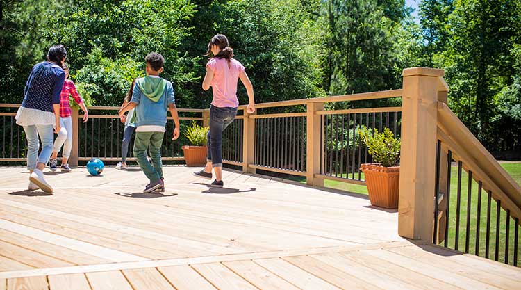 Pressure-Treated Lumber Decks Build with Close-to-Home Wood footer