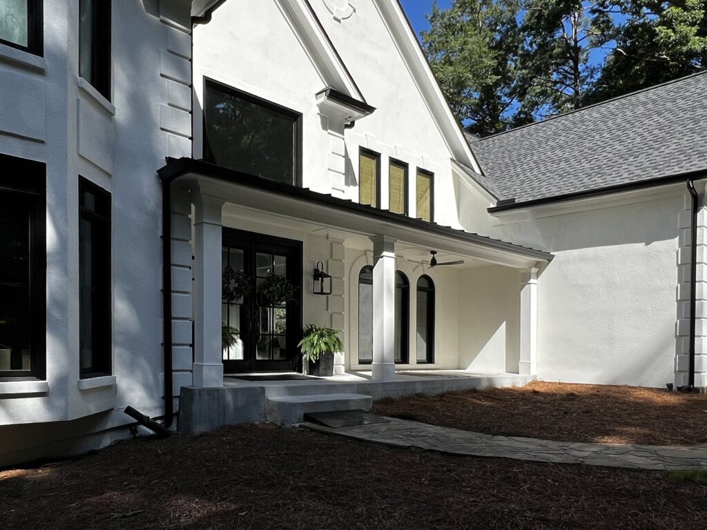 Roswell Half Porch Right View (extended portico, black metal roof with PVC columns, shed style roof, bead board ceiling)