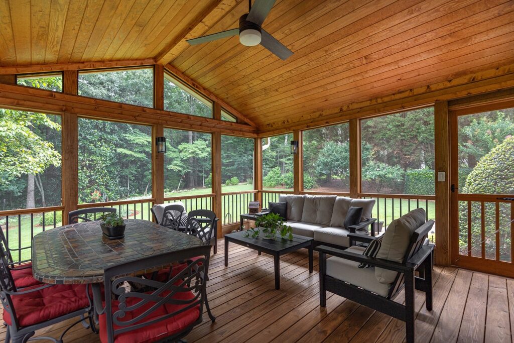 Milton Screened Porch Inside Left View by Atlanta Decking with with pressure-treated lumber and aluminum banisters