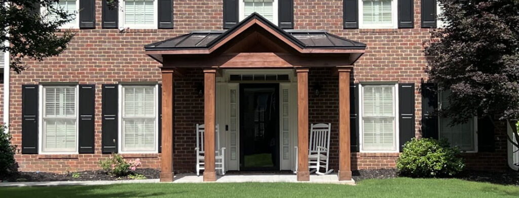 A Portico Makes the Perfect Covered Entryway for Storm Season (Roswell-GA-front-portico-for-two-story-traditional-brick)