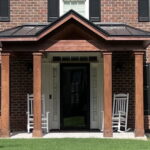 A Portico Makes the Perfect Covered Entryway for Storm Season (Roswell-GA-front-portico-for-two-story-traditional-brick)